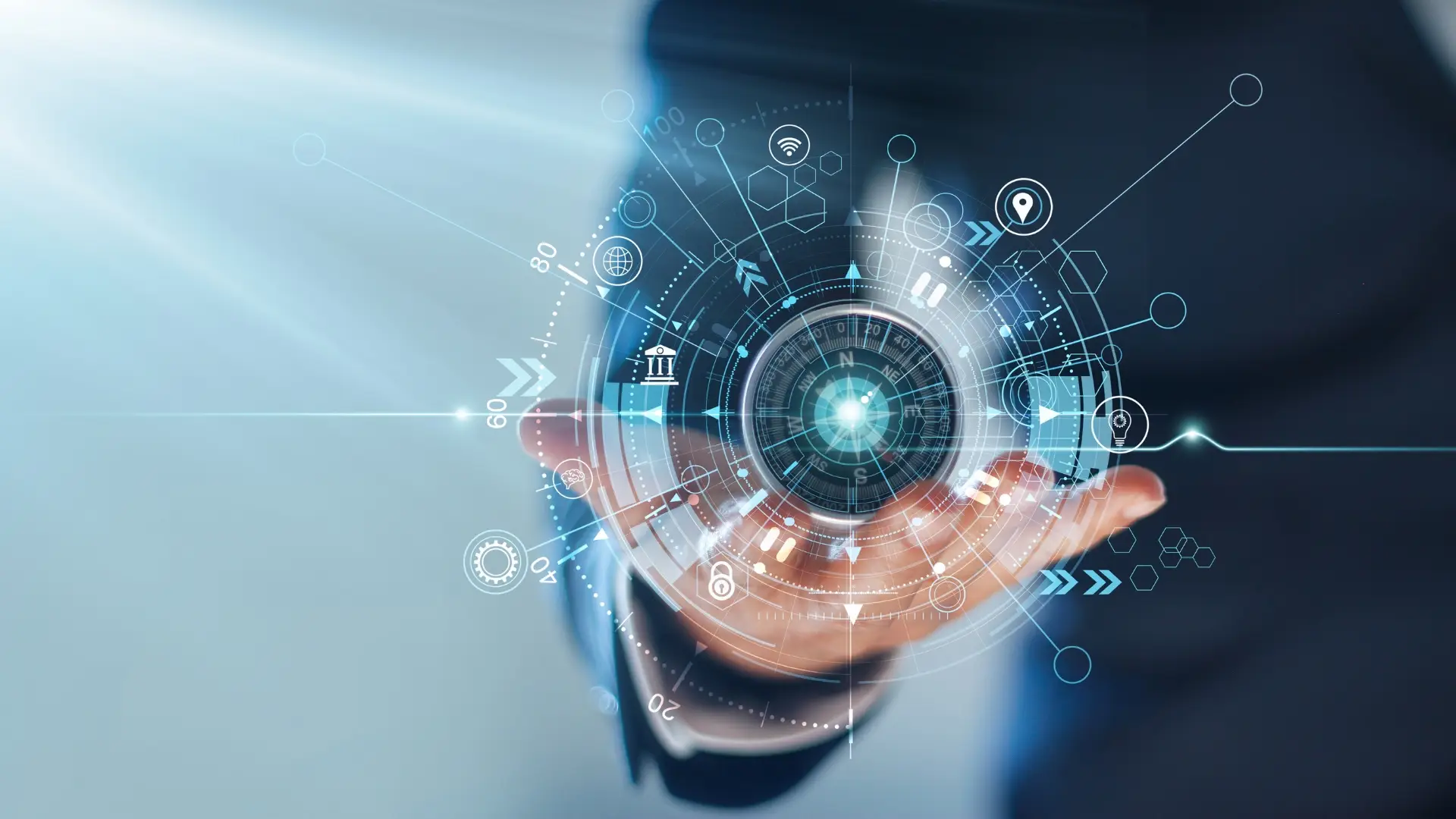 A person holds a holographic, futuristic interface with interconnected icons and symbols representing technology, data, and communication. The background is blurred, emphasizing the vibrant, glowing central display in the person's hand—a tool coveted by top project management organizations worldwide.