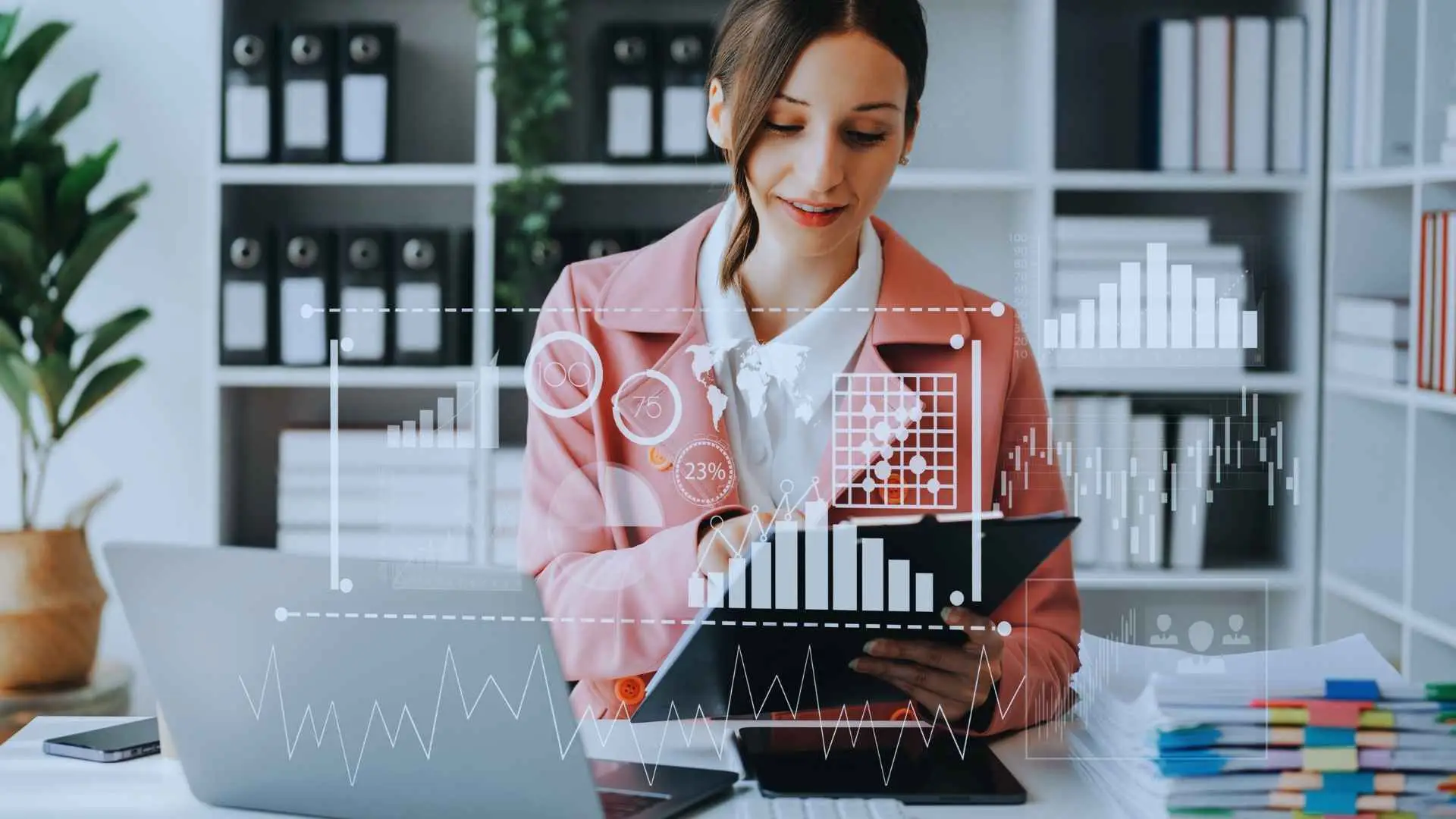 Businesswoman analyzing data on a tablet with virtual graphs and charts superimposed over the image, indicative of modern digital project management tools
