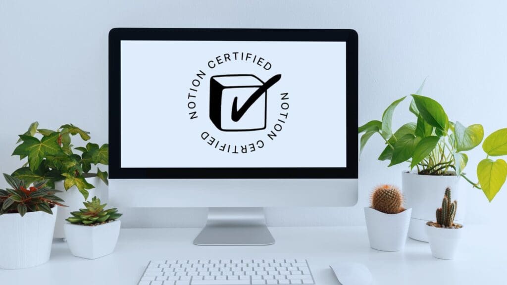 Modern workspace showcasing a computer screen with the Notion Certified logo, representing Notion Certification.