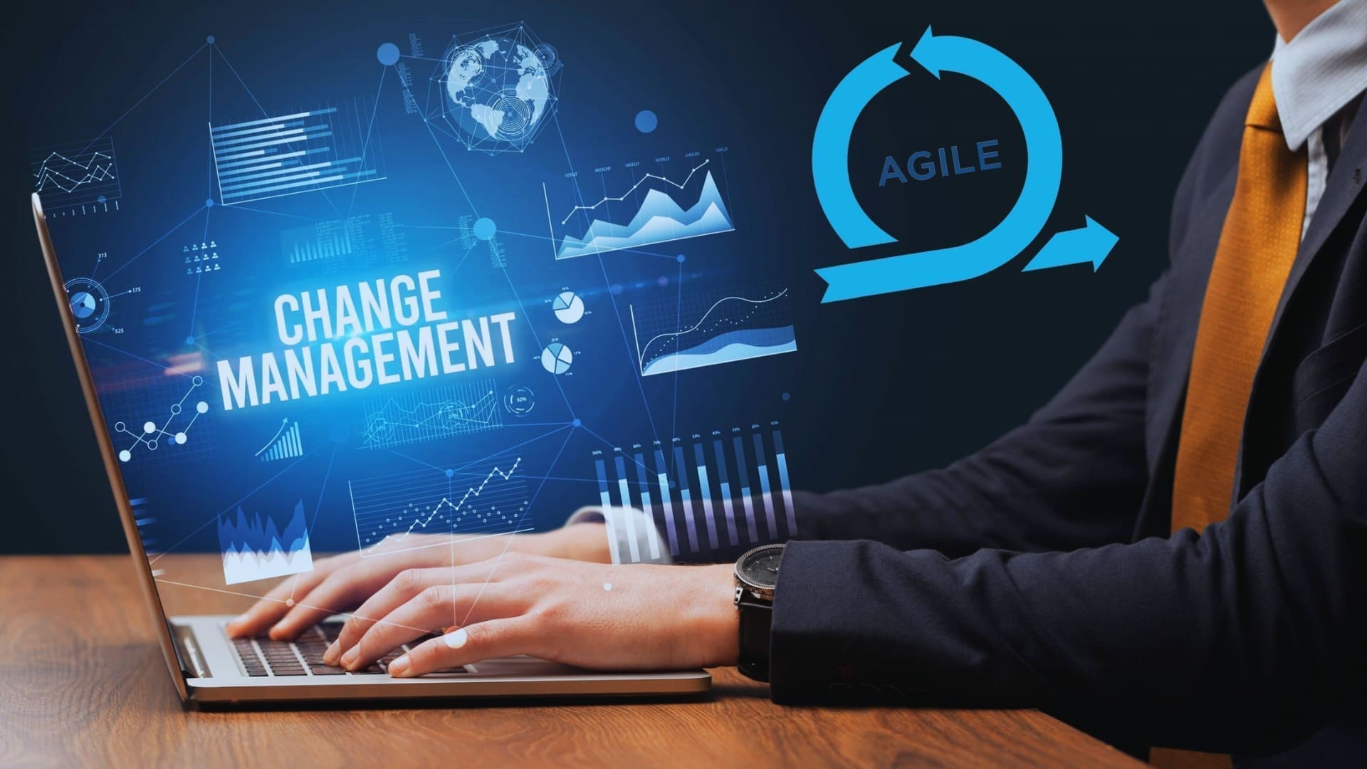 Person working on a laptop with an "Agile Change Management" graphic on the screen. Various data charts and an Agile methodology logo are displayed around the screen, symbolizing business processes and efficiency. The person is wearing a business suit.