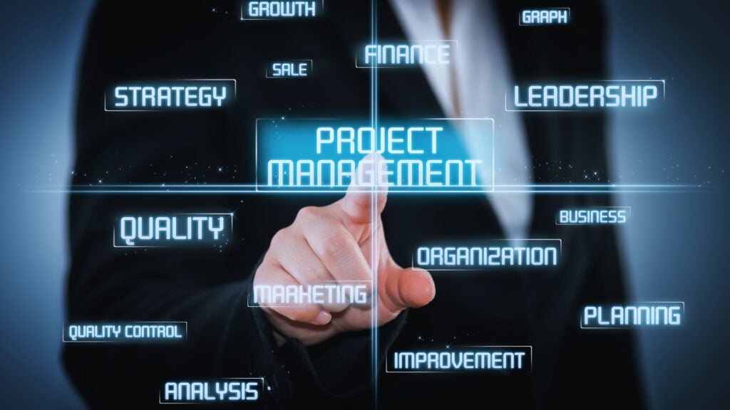 A person in a suit points to a glowing “Project Management” button on a transparent screen, surrounded by related terms like PMI Stakeholder Analysis, leadership, strategy, quality, planning, marketing, finance, analysis, and improvement.