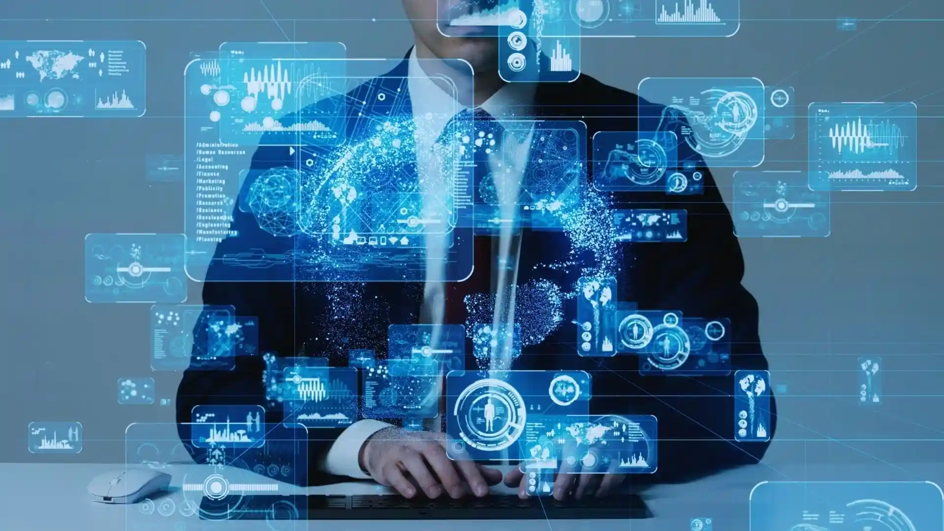 A person in a suit sits at a desk with their hands folded, surrounded by holographic digital interface graphics representing technology, data, analytics, and Agile Methodology Definitions.