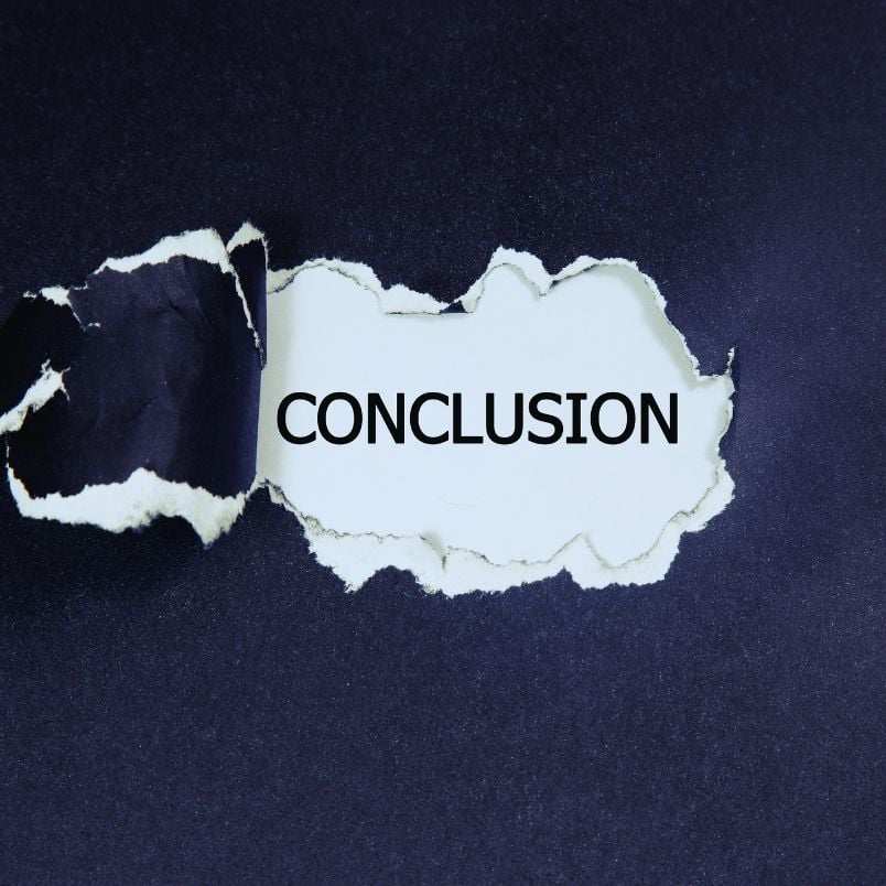 A piece of dark paper is torn open, revealing the word "CONCLUSION" in bold black letters—symbolizing the final verdict in the SmartSuite vs. Hive debate—on a white background underneath.