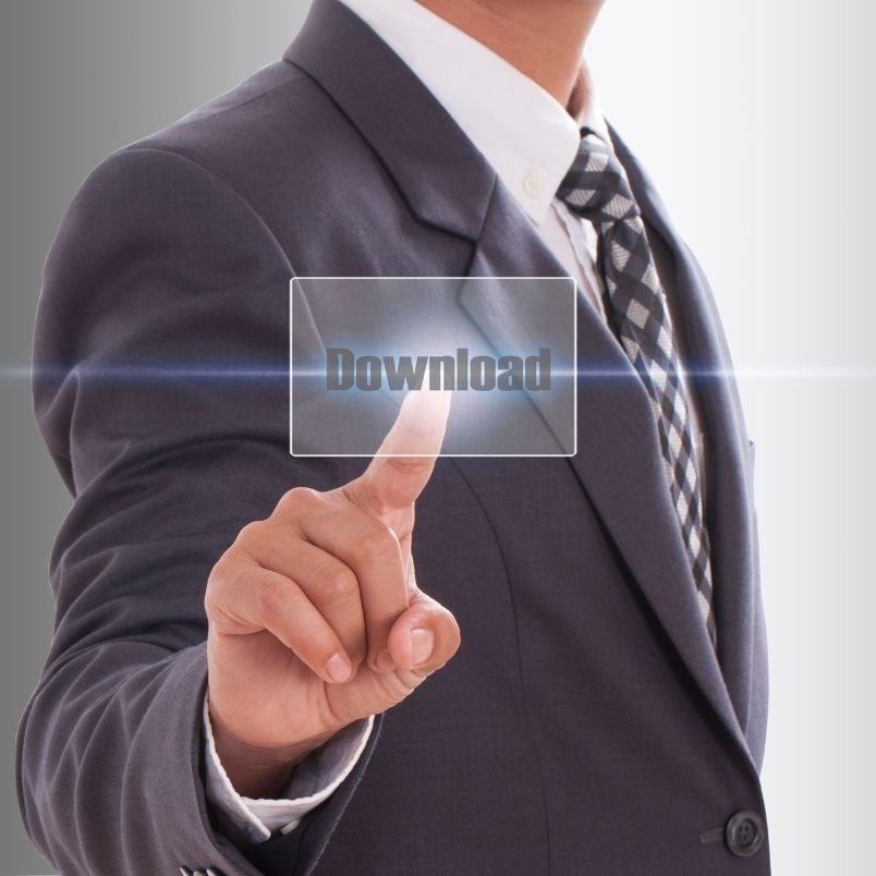 A man in a suit and tie is pressing a transparent virtual button labeled "Download" with his index finger, suggesting a digital concept such as release instructions or new software access.