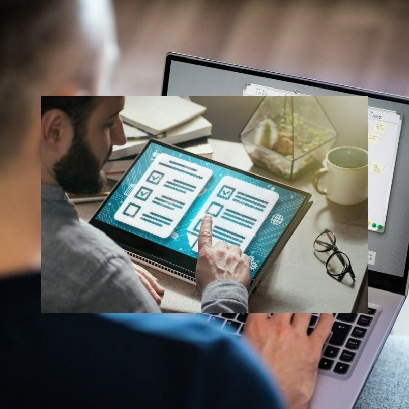 A person uses a laptop, with an overlay showing a hand interacting with a digital checklist on a tablet—reviewing common PMP exam mistakes. Nearby are glasses, a notebook, a cup, and a decorative plant on the desk.