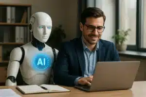 A man in glasses and a suit works on a laptop at a desk, smiling, while a humanoid robot with a glowing "AI" symbol on its chest sits beside him. An open notebook is on the desk.
