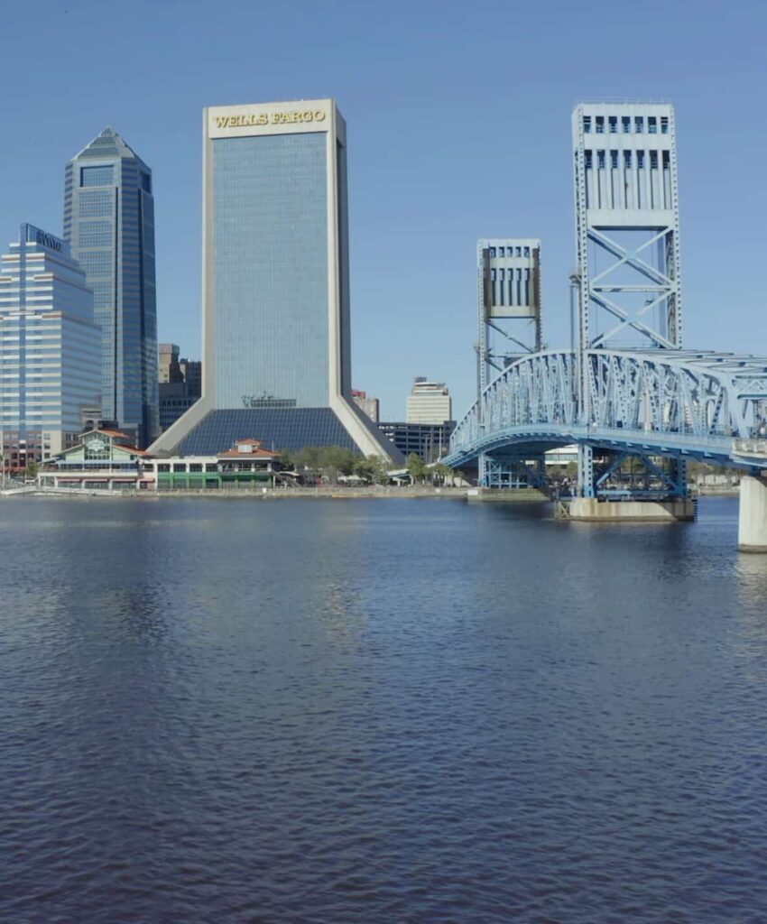 Downtown Jacksonville skyline and blue bridge; start PMP® or CAPM® training with free 7-day access, live office hours, and 1-on-1 coaching.