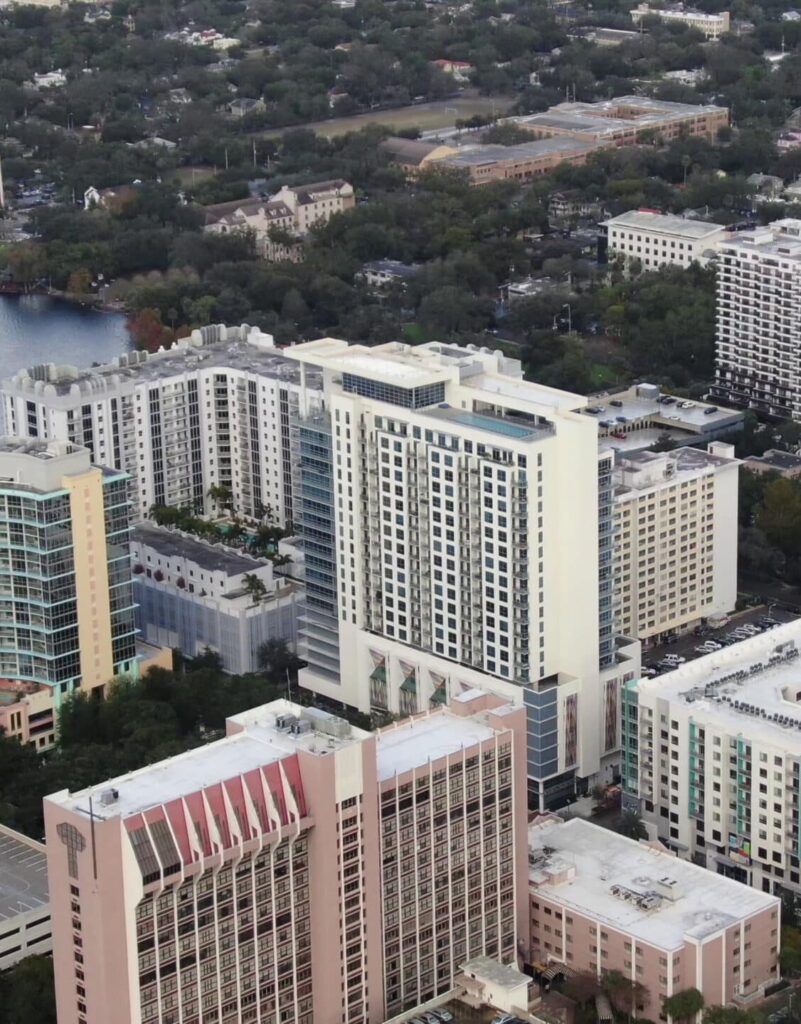 Aerial view of downtown Orlando skyline and lake; start PMP® or CAPM® training with free 7-day access, live office hours, and 1-on-1 coaching.